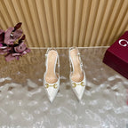 Gucci women's white slip-on heels with gold horsebit accents and pointed toe