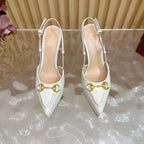 Gucci women's white pointed-toe slingback heels with gold horsebit bar detail