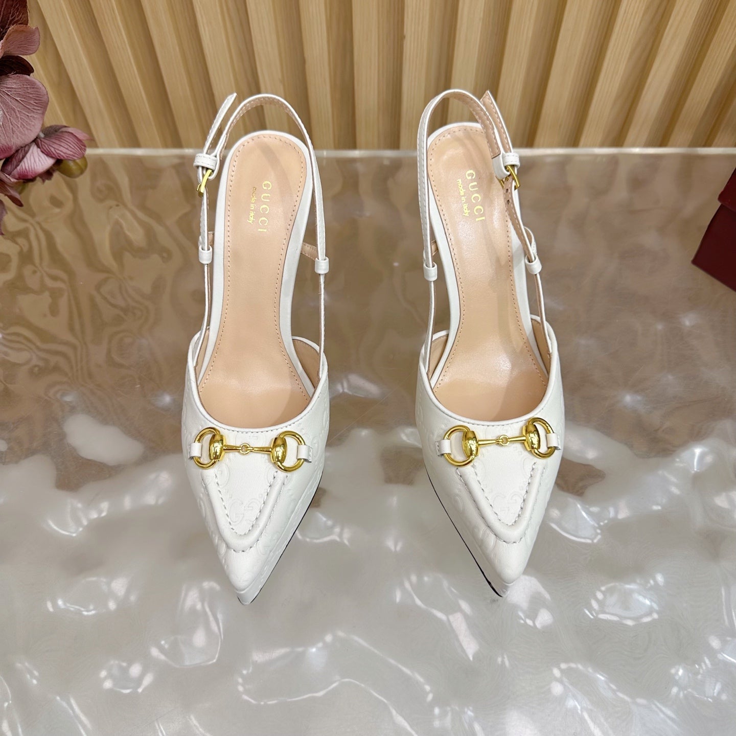Gucci women's white pointed-toe slingback heels with gold horsebit bar detail