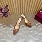 Brown Gucci slingback heeled mules with stiletto heels and gold ring buckle, side view