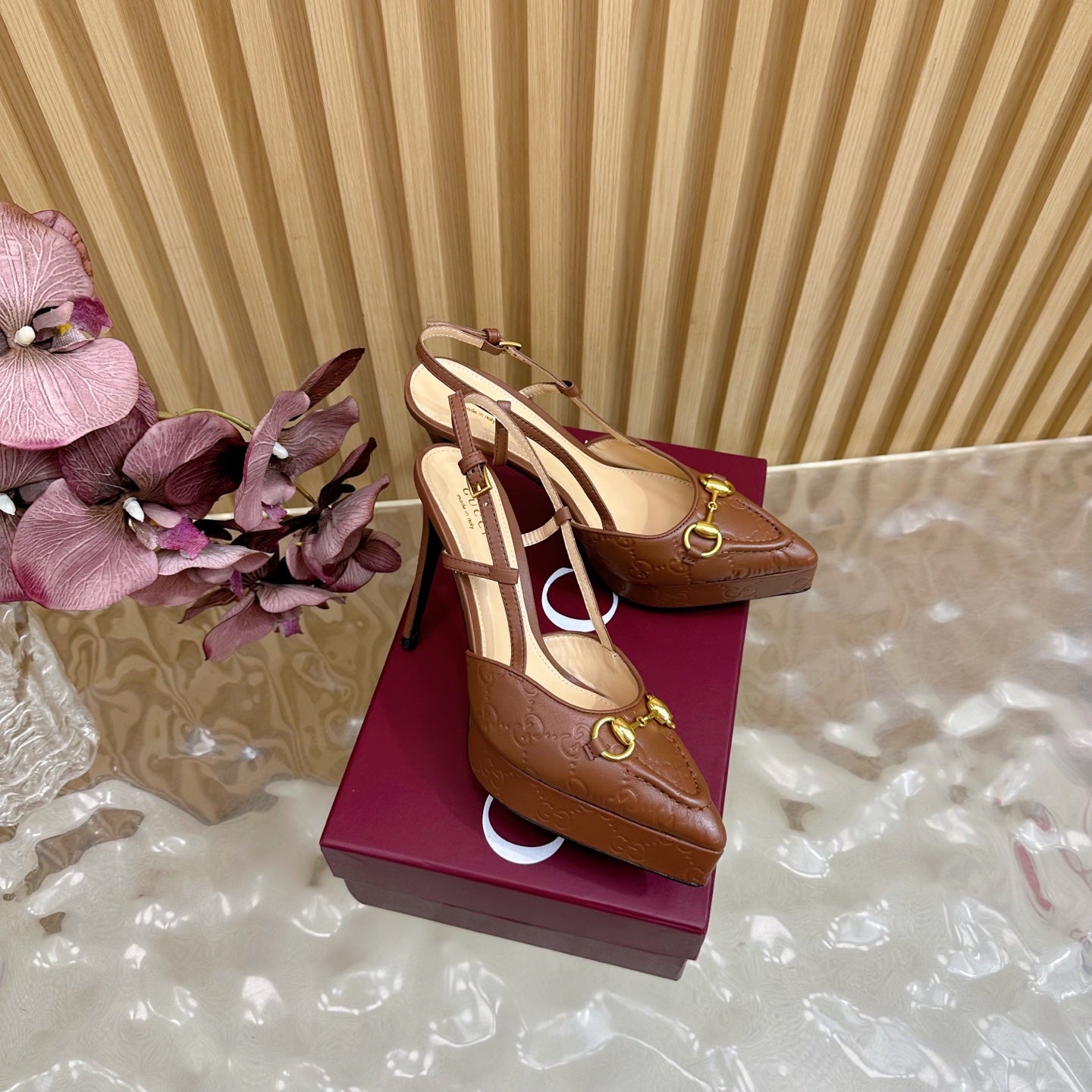 Brown Gucci slingback heeled mules, gold ring buckles, pointed toe