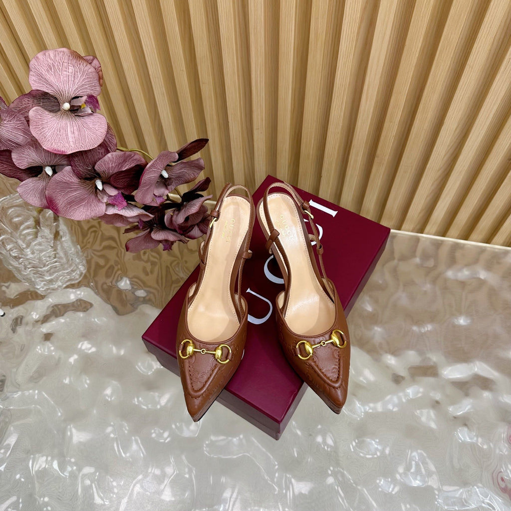 Brown Gucci slingback heeled mules, pointed toe, gold buckle detail