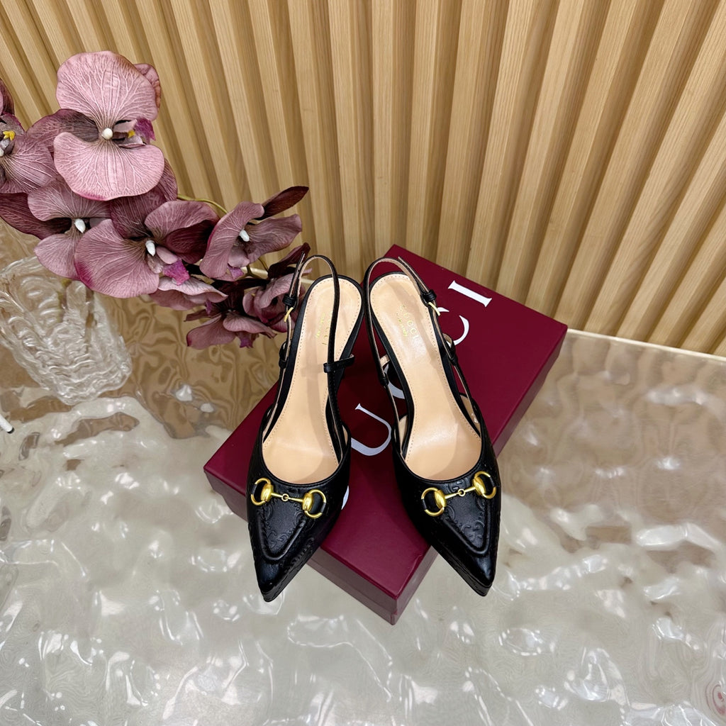 Black slingback stiletto heels with gold ring buckle, pointed toe