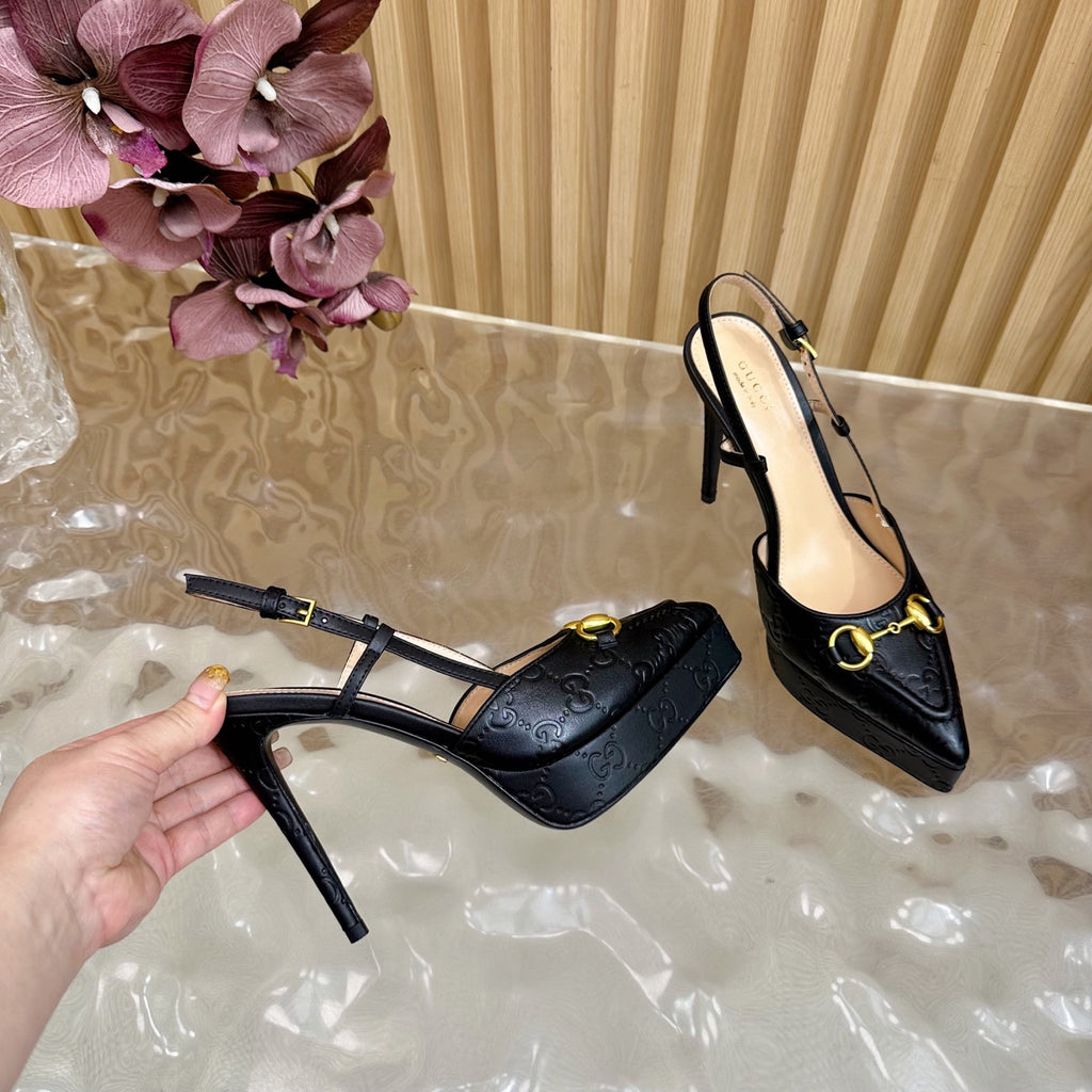 Black slingback stiletto heels with gold ring buckle and textured upper