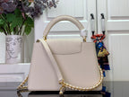 Louis Vuitton bag in white textured leather with foldover flap and chain strap