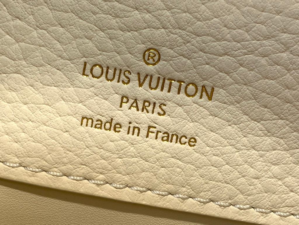 Louis Vuitton Paris made in France stamp on white leather bag