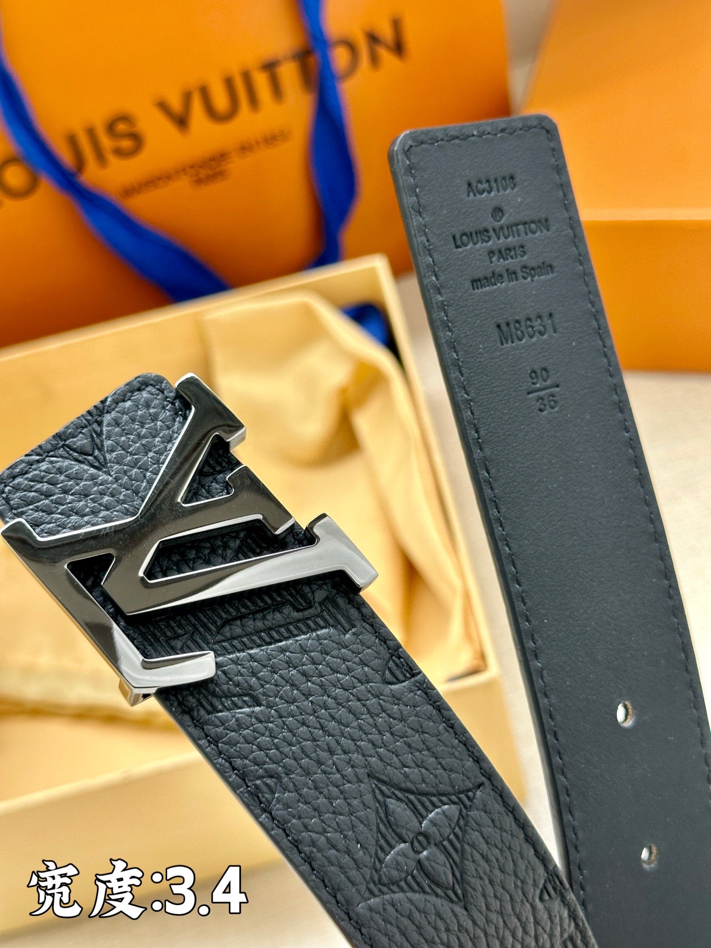 Dark blue leather belt with LV buckle and embossed logo strap detail