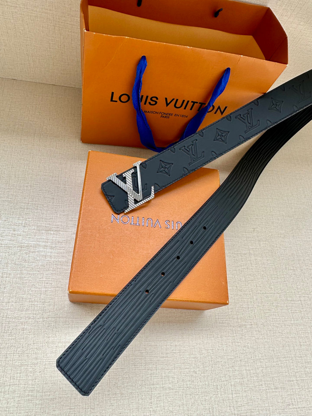 Leather belt strap with embossed monogram and gold LV buckle, dark blue