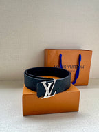 Dark blue leather belt with large gold-toned LV buckle, laid for display