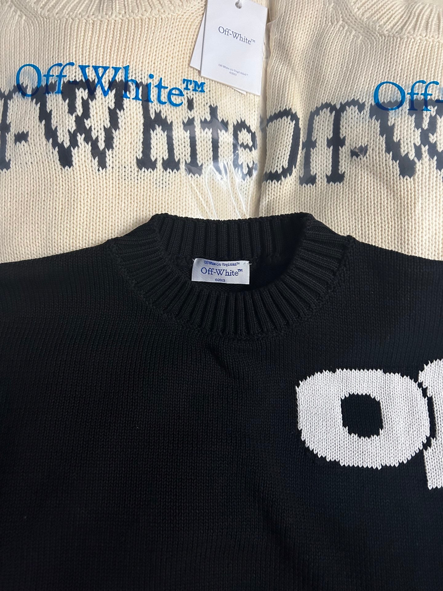 Black knit sweater neckline and white Off-White chest logo detail
