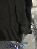 Black knit sweater cuff and ribbed hem detail