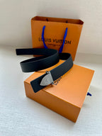 Louis Vuitton belt with dark blue leather strap and silver-tone buckle on box