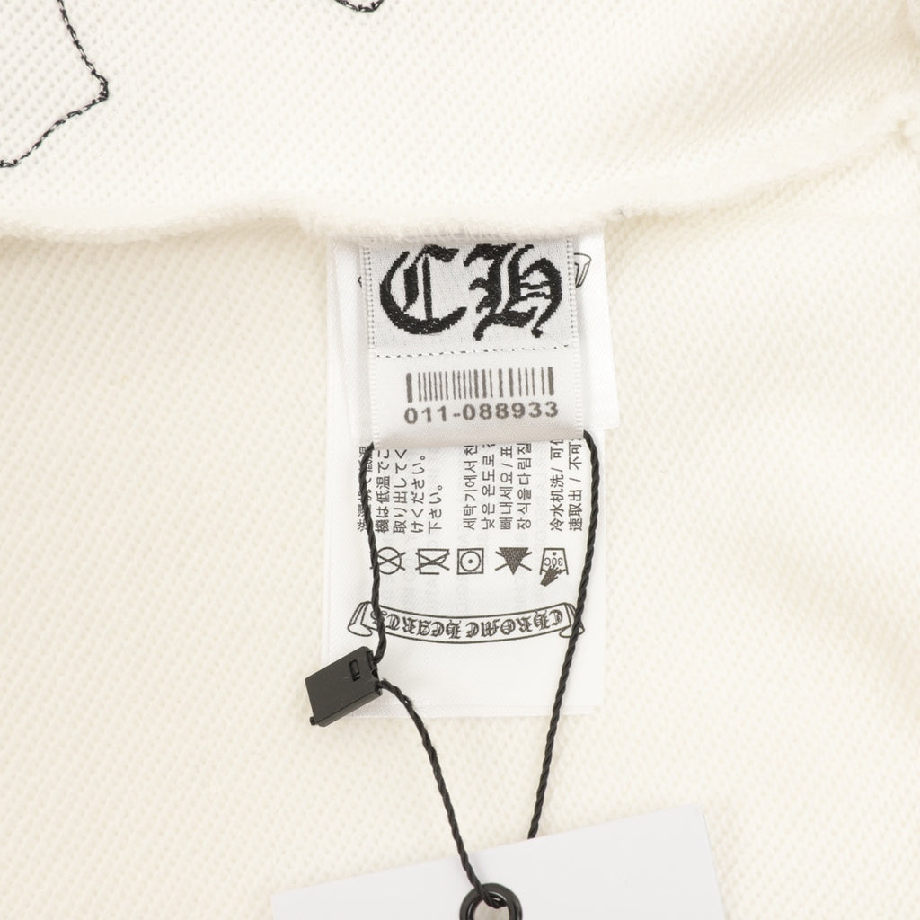 Cream sweatshirt neckline with white size label and care tags