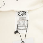 Cream sweatshirt neckline with white size label and care tags