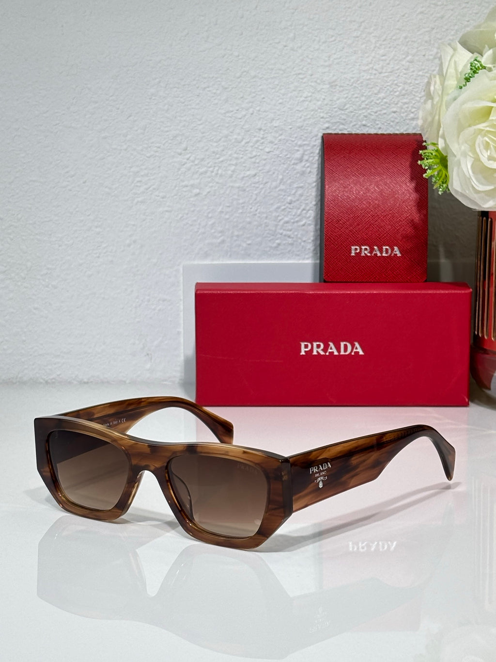 Prada tortoise cat-eye sunglasses with brown lenses