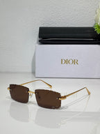 Dior sunglasses with brown lenses, gold-tone frame and curved metal temples