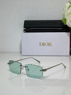Dior sunglasses with mint-green lenses, gold-tone frame and slim temples