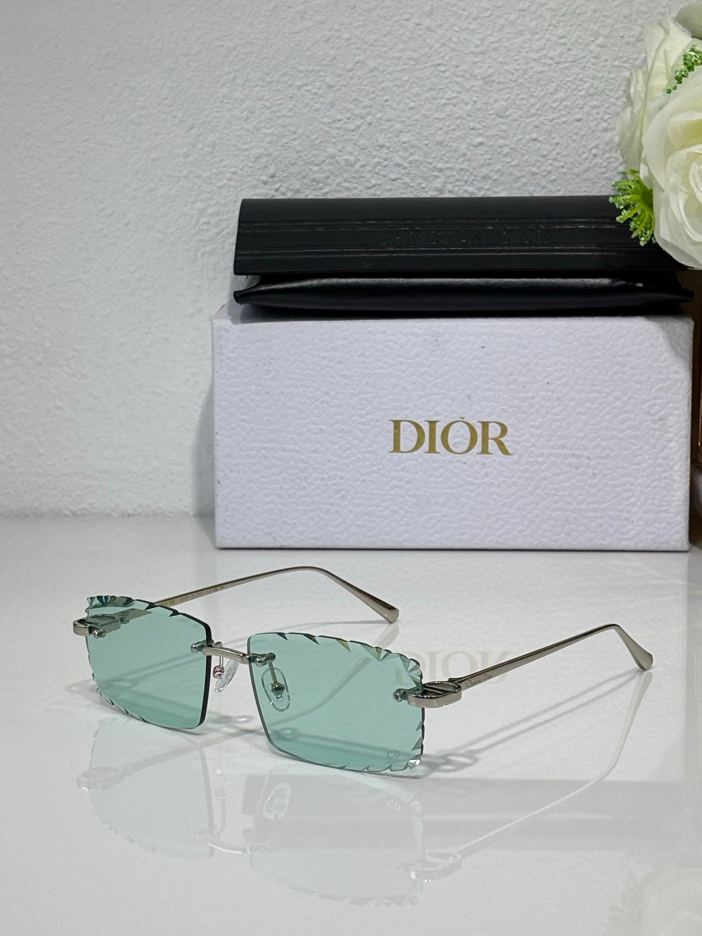 Dior sunglasses with mint-green lenses, gold-tone frame and slim temples