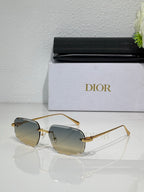 Sunglasses with light amber tinted lenses and thin gold-tone metal frame