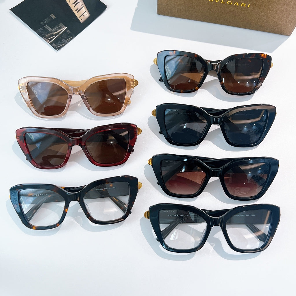 Assorted sunglasses set with dark, blue, tortoiseshell, and red frames with gold accents