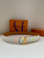 Designer belt in light blue and white canvas with tan holes and silver buckle