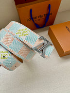 Patterned canvas belt with silver buckle and blue-green monogram leather keeper