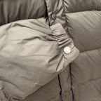 Snap buttons and gathered inner lining on quilted puffer jacket