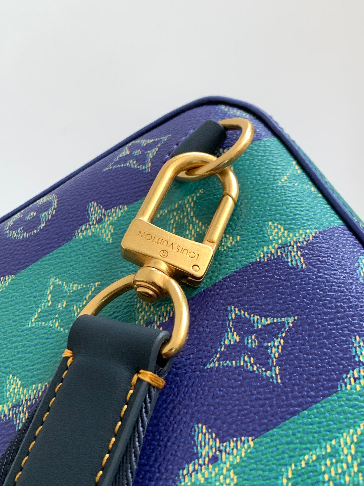 Louis Vuitton multicolor monogram bag with gold padlock clasp and blue key charm