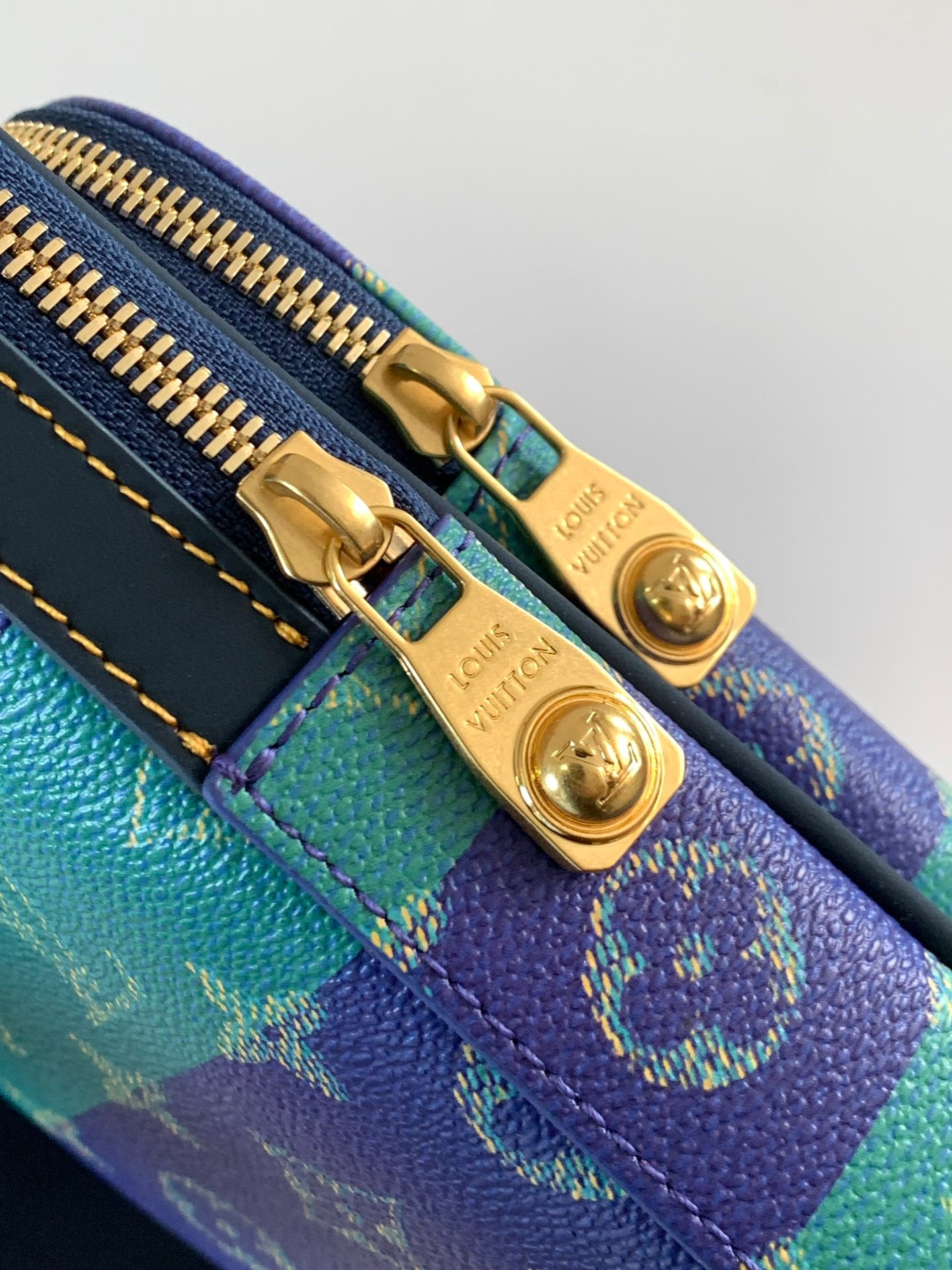 Louis Vuitton multicolor monogram crossbody bag detail of dual zipper pulls and hardware