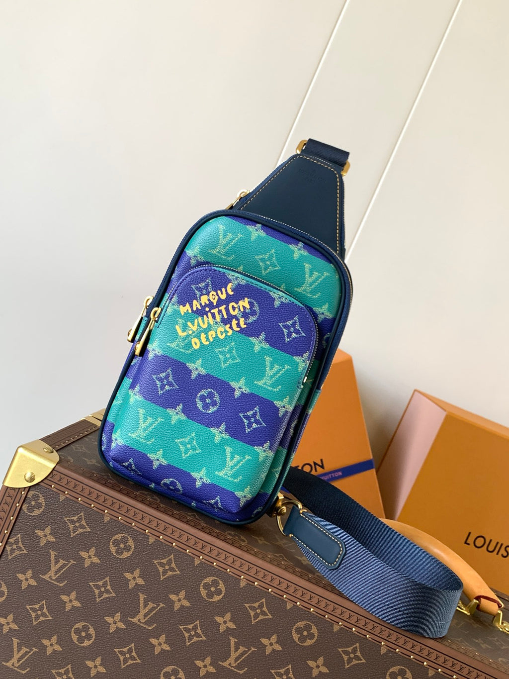 Louis Vuitton multicolor monogram crossbody bag with blue strap and front zip pocket