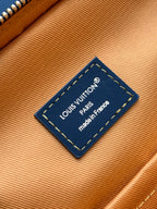 Louis Vuitton inner label on tan lining: “Louis Vuitton Paris” and “made in France”