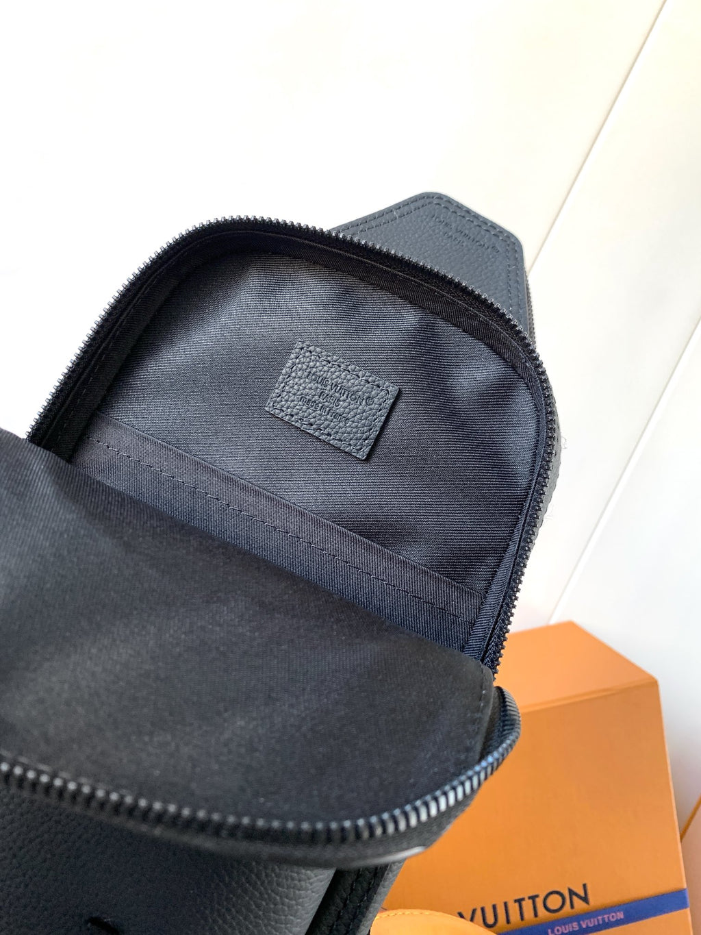 Louis Vuitton dark blue zip-top mini bag with interior lining and label patch