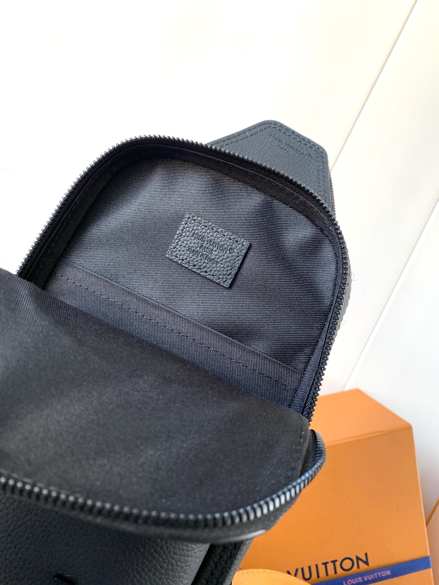 Louis Vuitton dark blue zip-top mini bag with interior lining and label patch