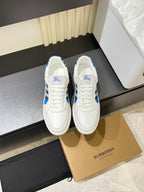 White Burberry sneakers with blue and black check panels, lace-up design