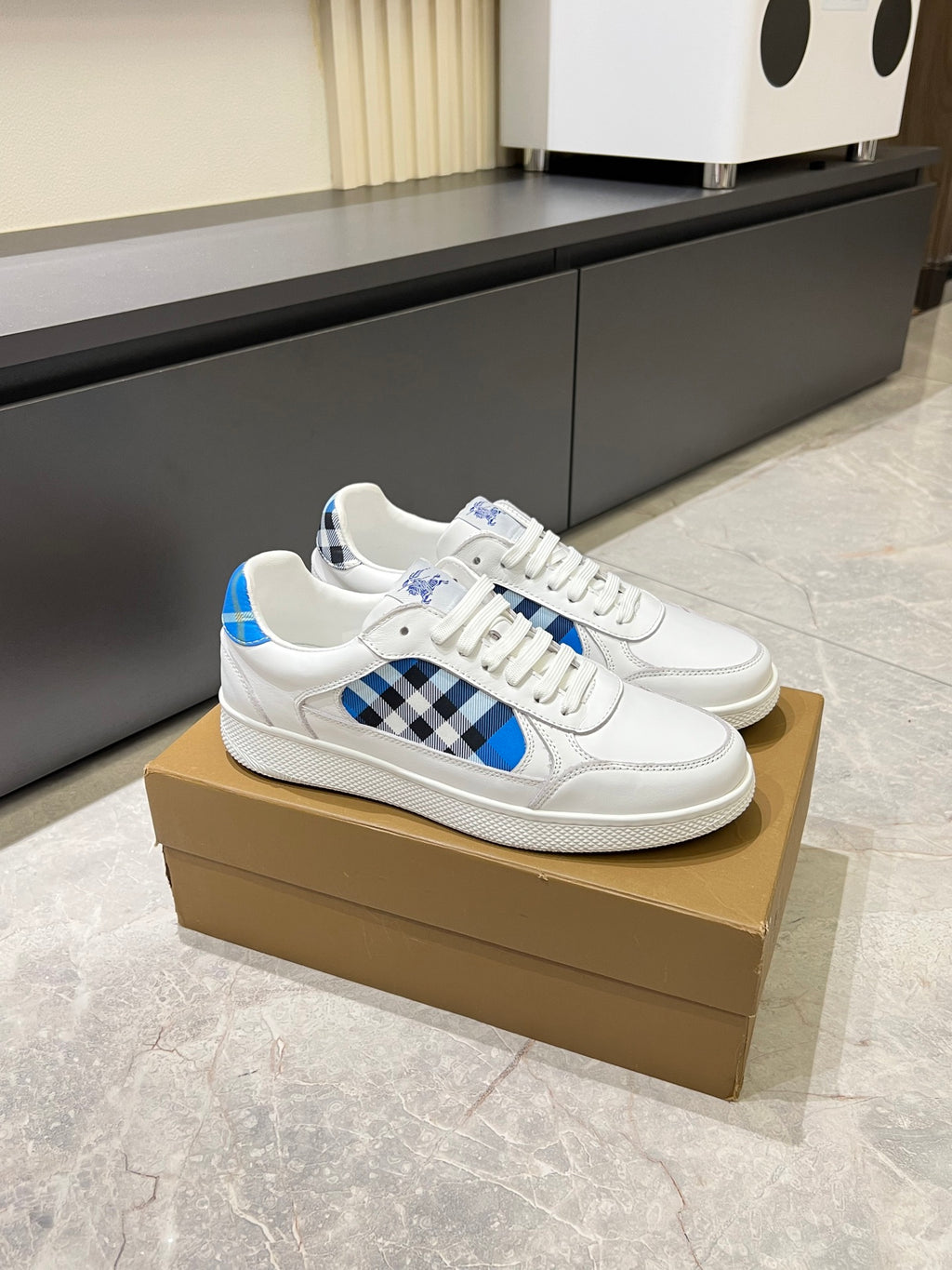 White Burberry lace-up sneakers with blue panel and black check detail