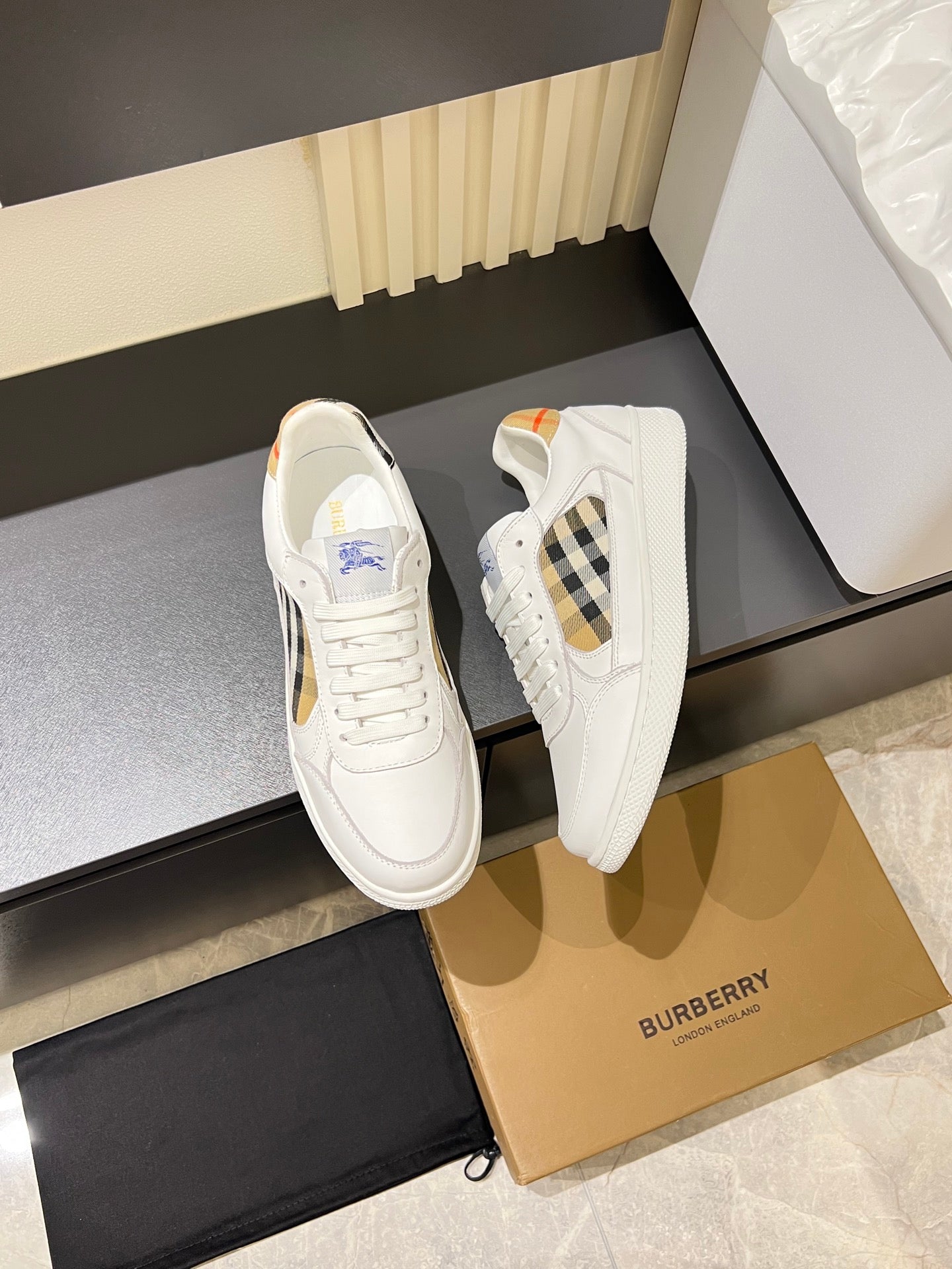 Pair of white Burberry check lace-up sneakers with multicolor heel tabs