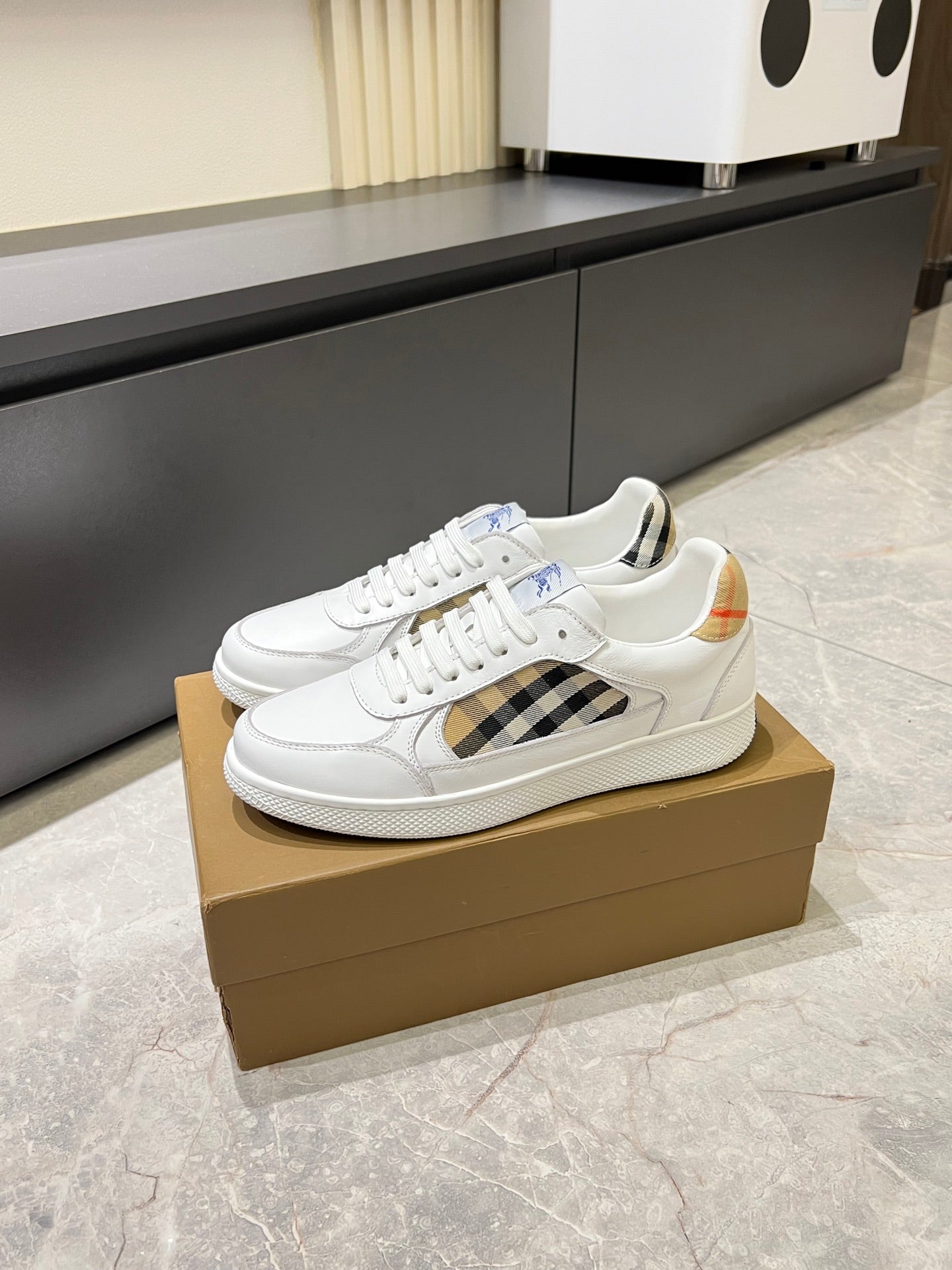 White Burberry check lace-up sneakers on display with textured sole