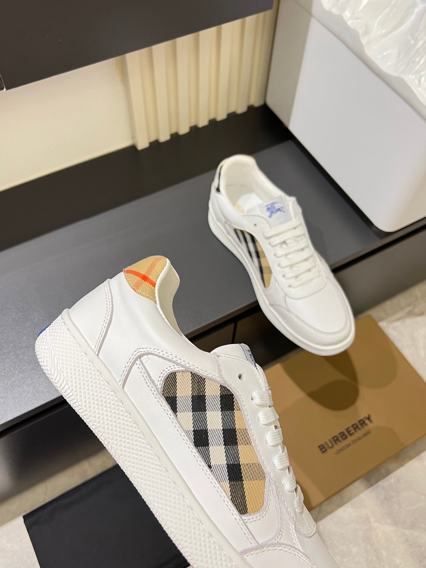 White Burberry check lace-up sneakers with tan and blue accents