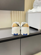 Back view of white Burberry check lace-up sneakers with blue heel tabs