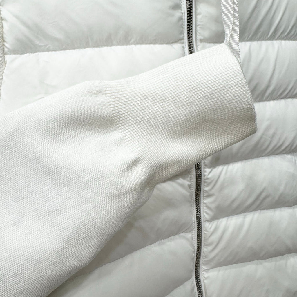 White puffer jacket sleeve cuff and quilted baffles with zip detail