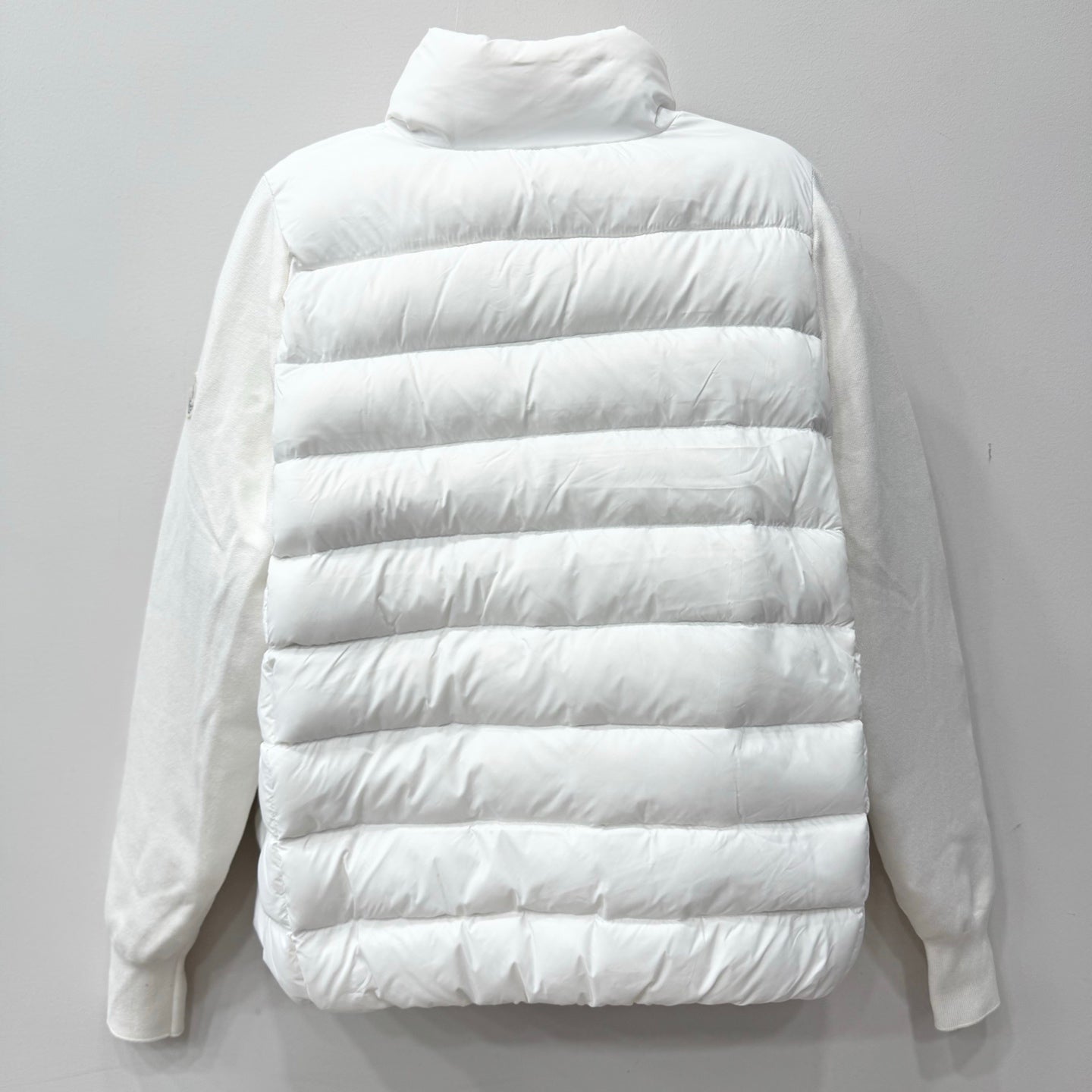 White long puffer jacket with quilted horizontal baffles and stand collar