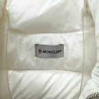 White puffer jacket interior with Moncler logo brand label