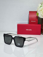 Prada sunglasses with black frame and dark lenses