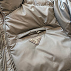 Prada puffer jacket chest logo patch on zipper placket, tan fabric