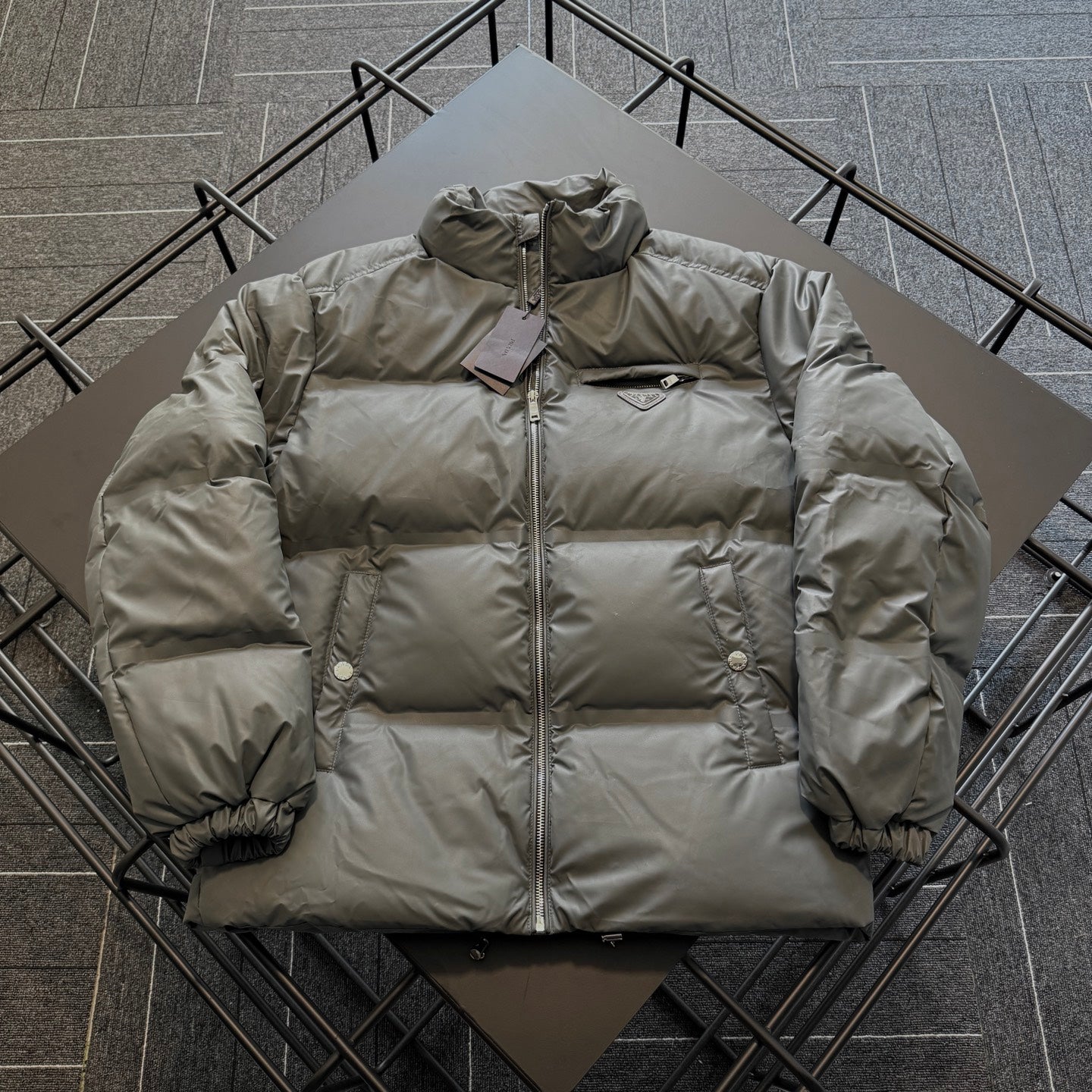 Prada long puffer jacket, olive outer, hood, front zip, ribbed sleeve cuffs