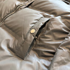 Prada puffer jacket shoulder pocket with metal snap and seam stitching, tan fabric