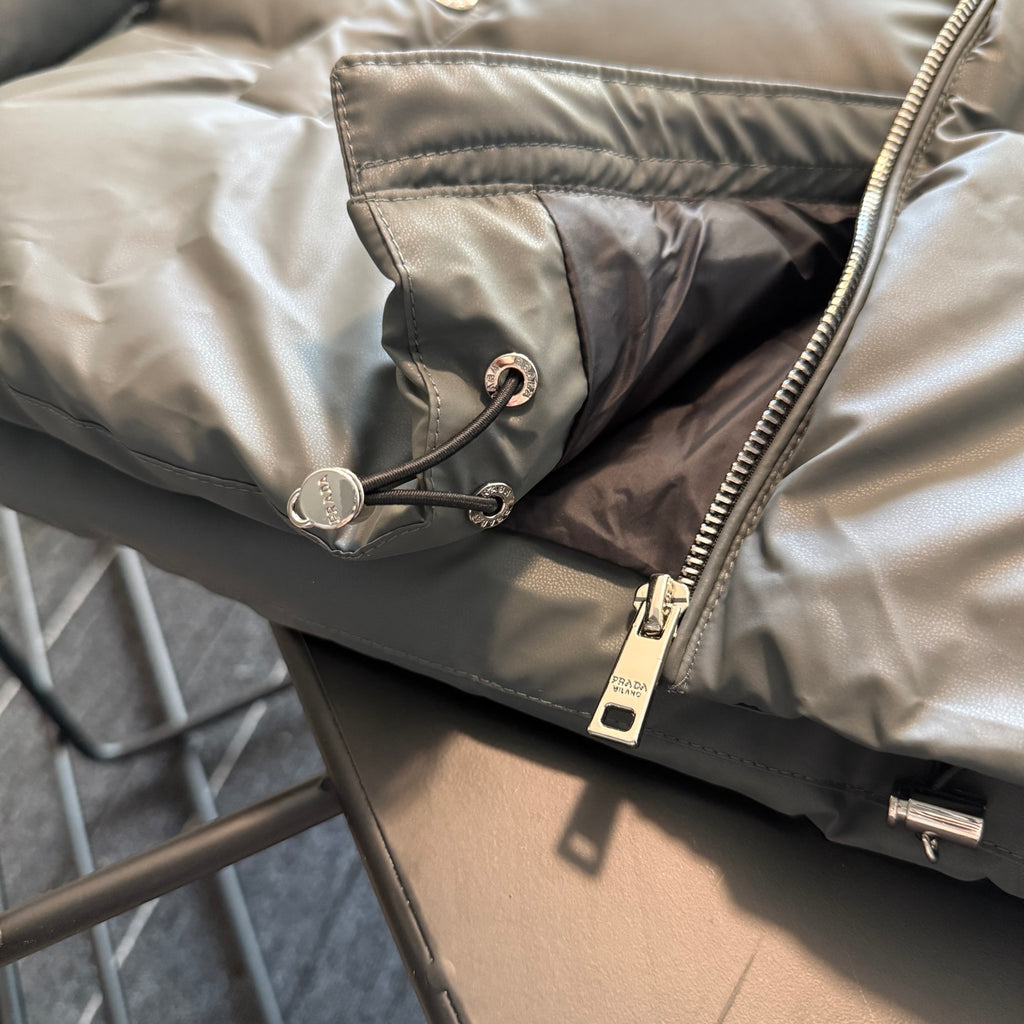 Prada puffer jacket interior pocket with drawcord and zipper pull, tan fabric