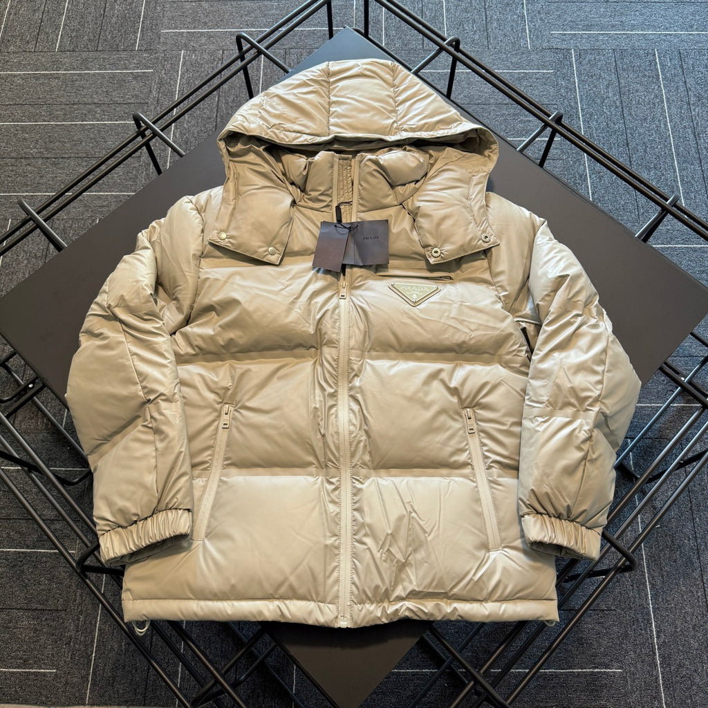 Beige hooded puffer jacket with full-length zipper and front patch pockets