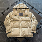 Beige hooded puffer jacket with full-length zipper and front patch pockets