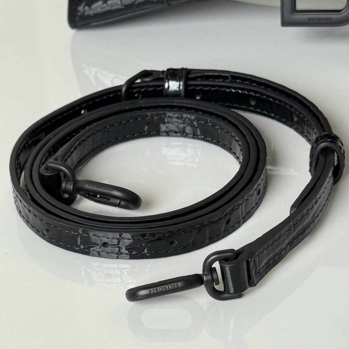 Balenciaga bag strap with black hardware clips and adjustable leather strap, croc-embossed